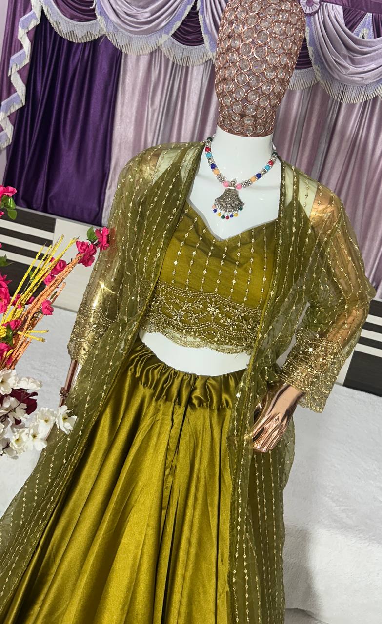 Party Wear Silk Green Lehenga Choli With Shrug